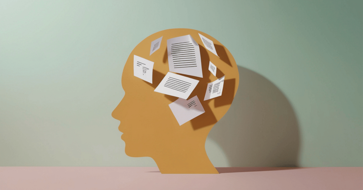 Illustration of a human head filled with scattered papers, representing mental load and multiple decisions happening at once in marketing