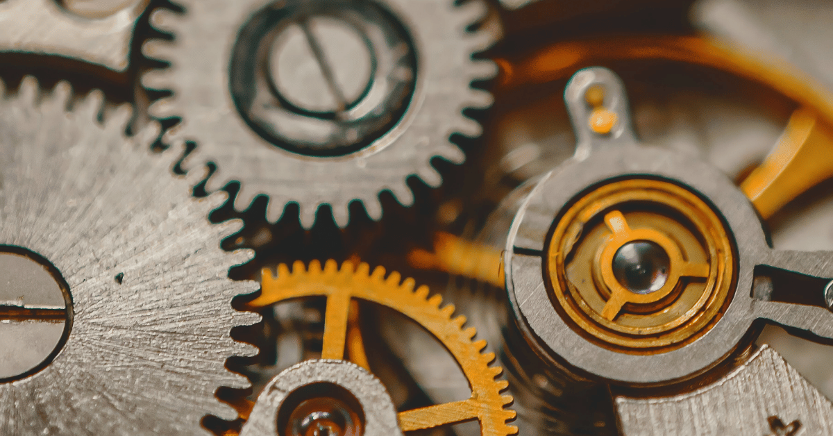 Close-up of mechanical gears working together, symbolizing a connected marketing strategy rather than isolated tactics.