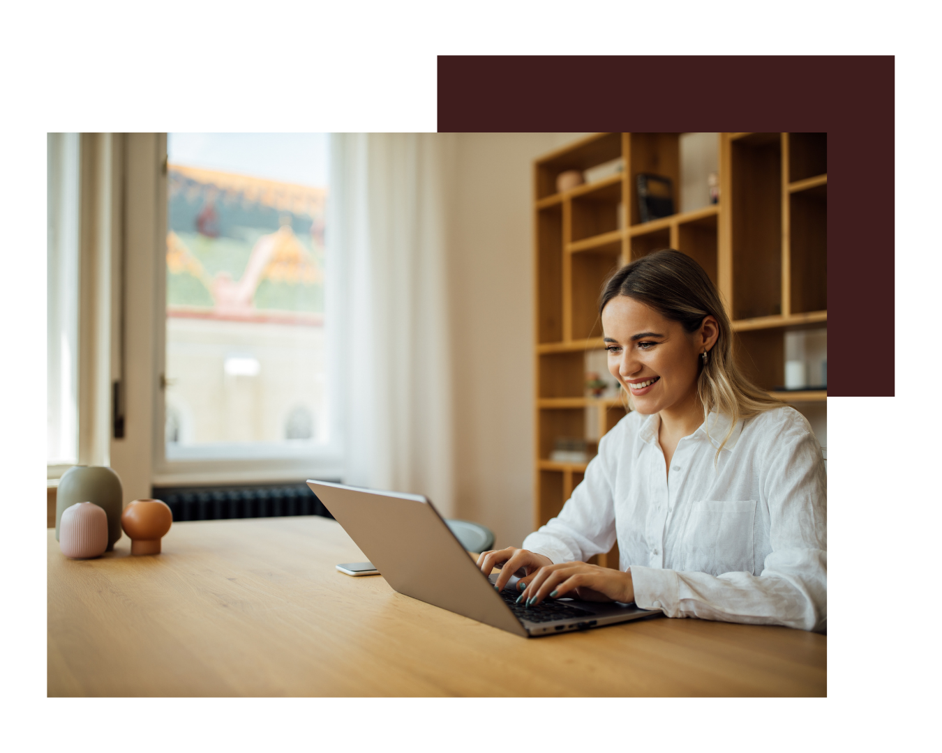 woman-smiling-looking-at-laptop woman-smiling-looking-at-laptop